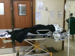 A mother waiting outside the operating room at Mulago Hospital